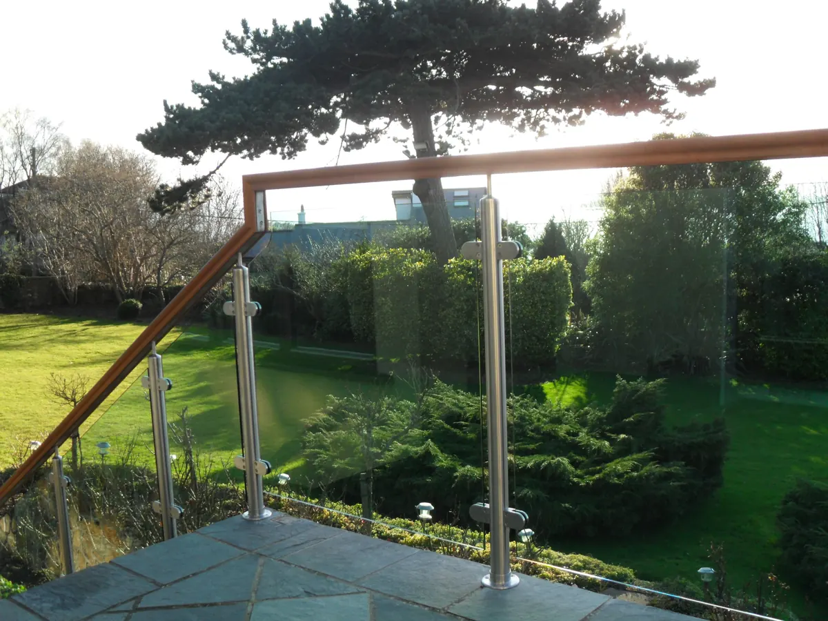 Balcony and steps with timber topped glass balustrade