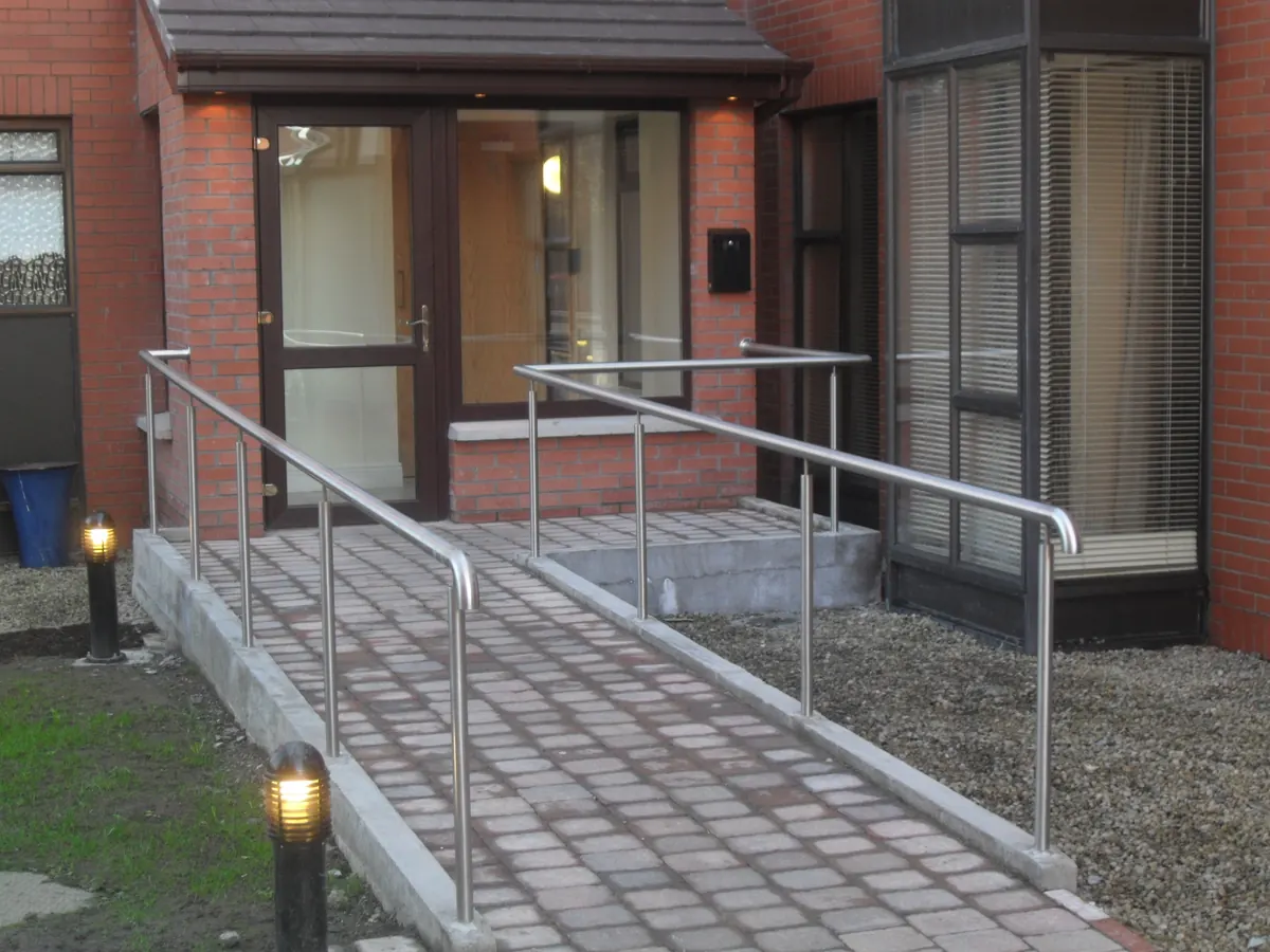 Stainless handrails on an apartment block ramp