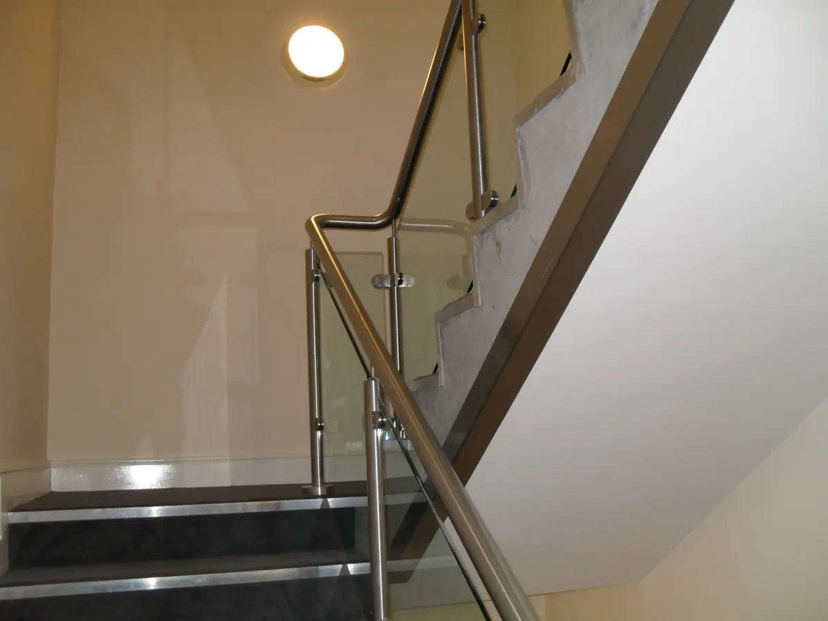 Stair well with stainless handrail